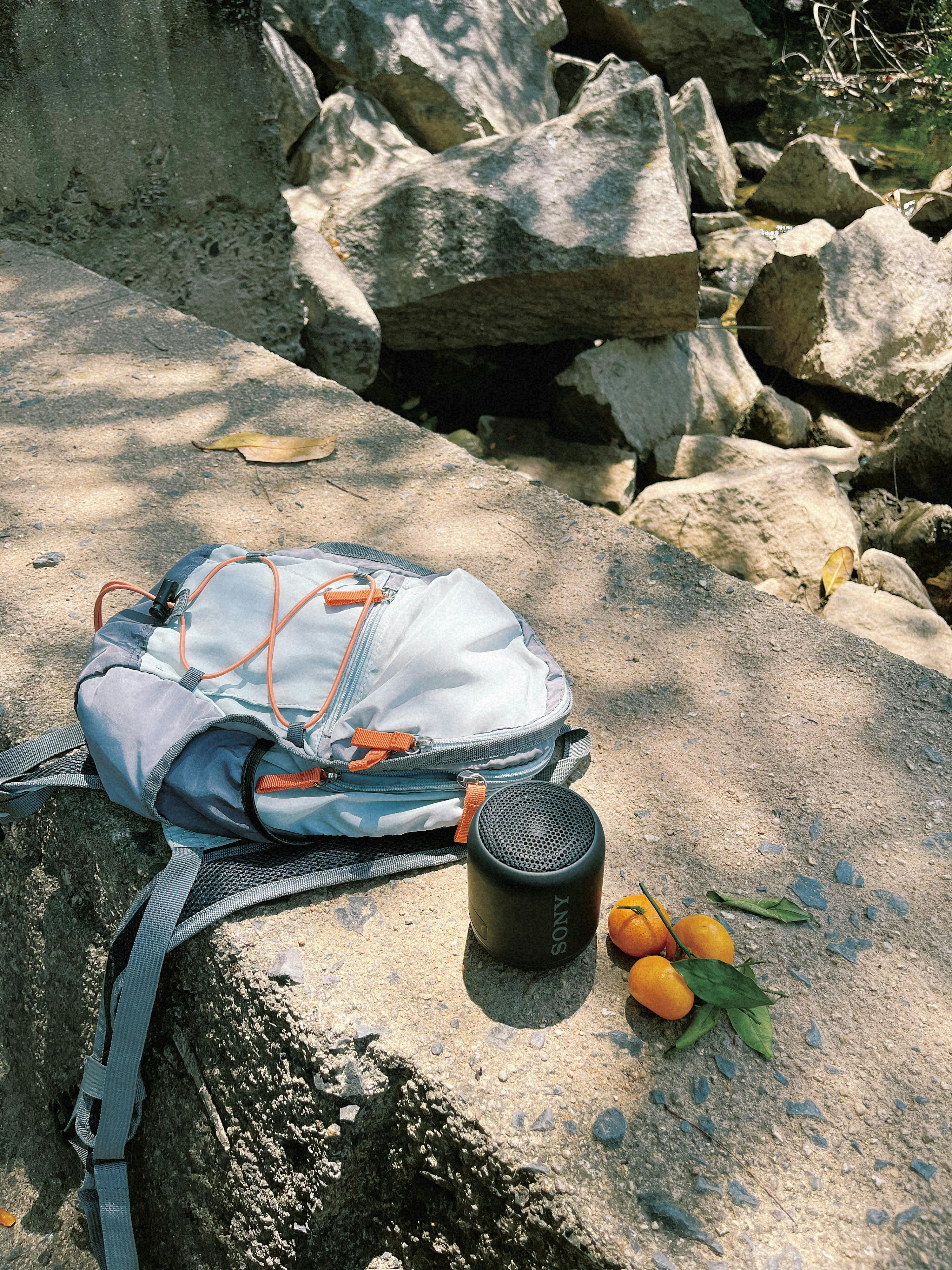 Hiking gear laid out on a wooden surface ready for a summer trip